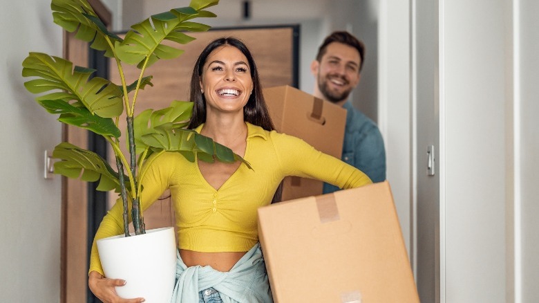  Young couple with moving boxes 