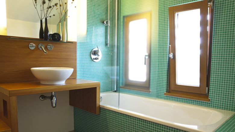 Aquamarine mosaic tiled bathroom