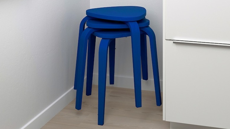 Blue IKEA stools in corner