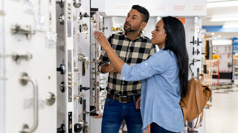 A couple shopping for cabinet hardware