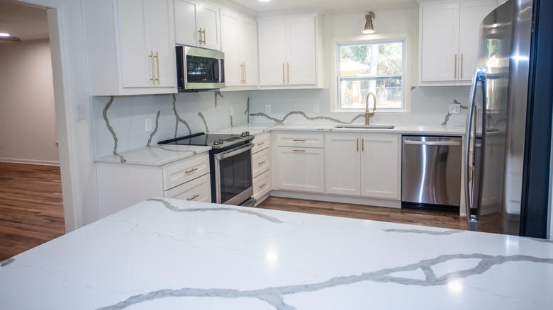 Kitchen with white quartz countertops