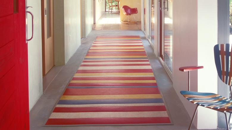 striped rug down a hallway