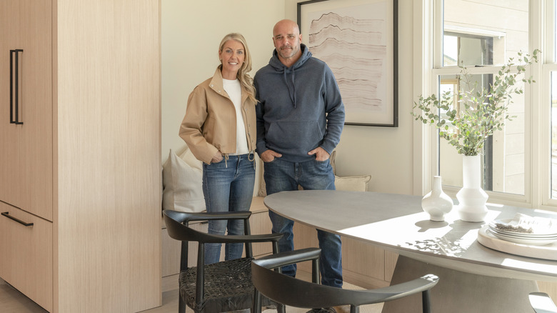 Sarah and Bryan Baeumler posing in finished dining room