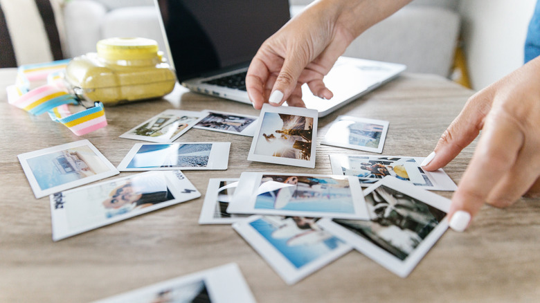 sorting photos on table