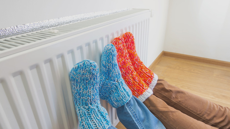 feet against heater