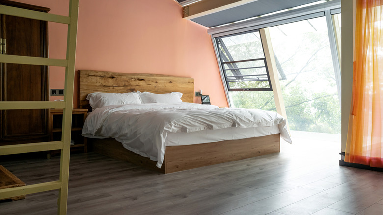 Extra storage underneath a wooden bed.