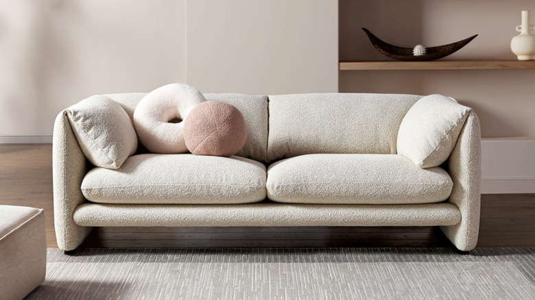 cream bouclé curved sofa