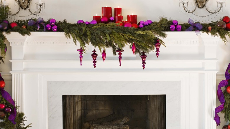 Christmas garland on white fireplace