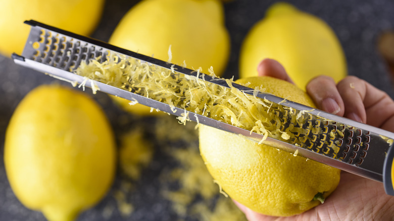 Person grating lemon