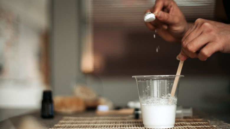 Woman making baking soda paste