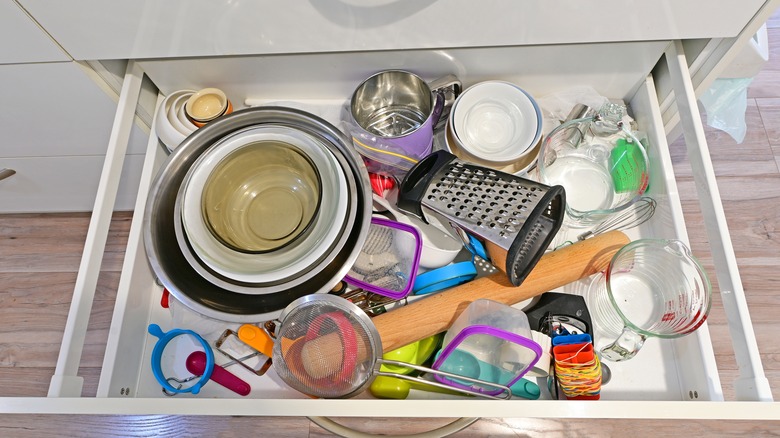 cluttered kitchen drawer