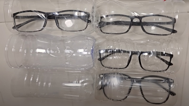 Eyeglasses are stored inside plastic bottles