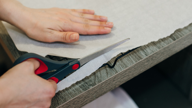 Person cutting wax paper