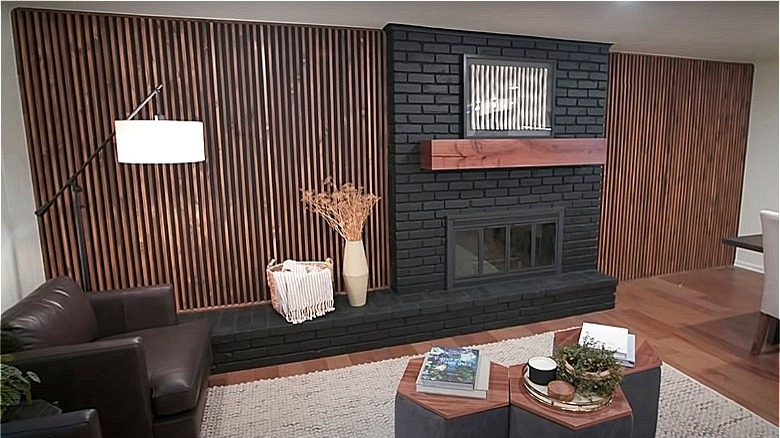 wooden slats around black fireplace