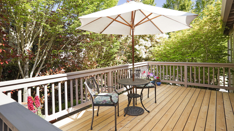 A small round umbrella table combo on a terrace