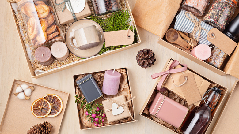 Collection of gift boxes with with kitchen-related gifts such treats, a tin, and more