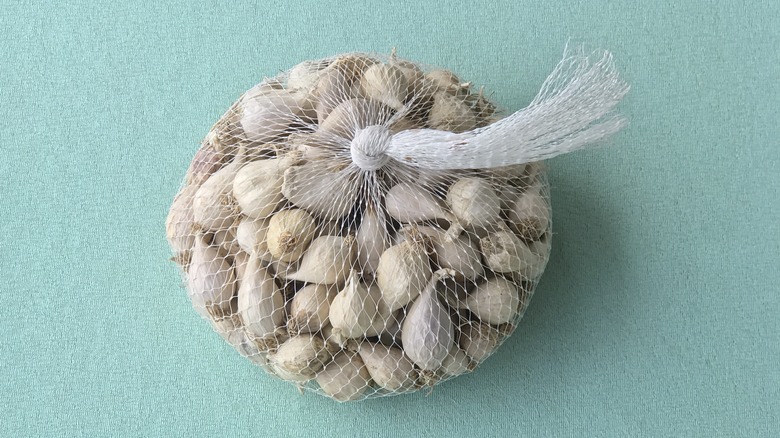 Garlic cloves in mesh bag