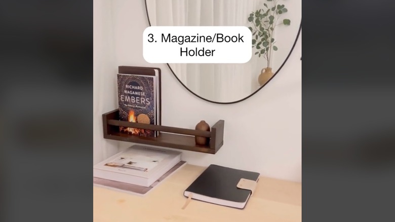 Magazines on floating shelf