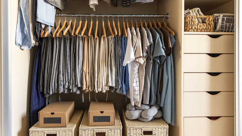 Open closet with neatly organized clothes