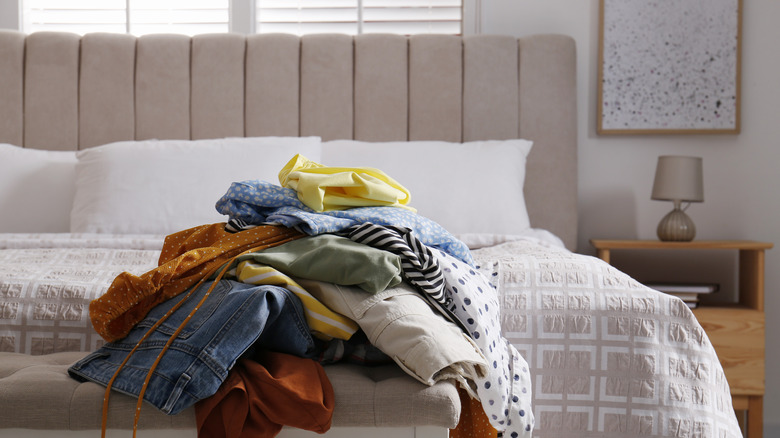 pile of laundry on bed