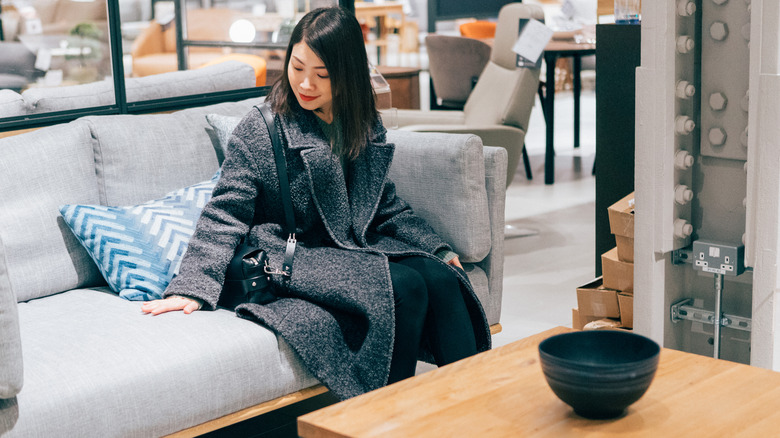 Person looking at a couch in a furniture store