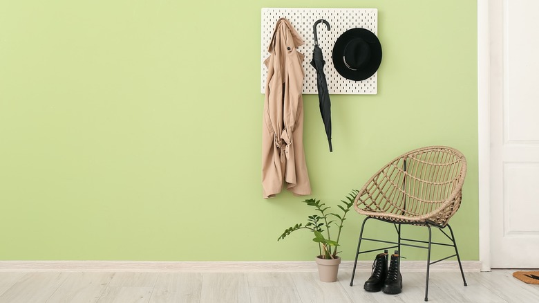 pegboard coat hanger in entryway