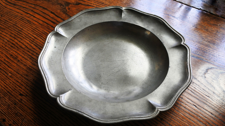 Pewter plate on table