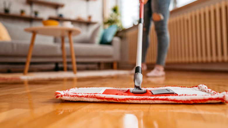 Person mops hardwood floor