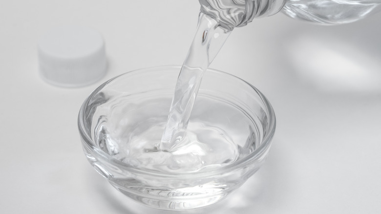 Pouring vinegar into a bowl