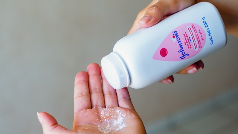 Baby powder being poured into a hand