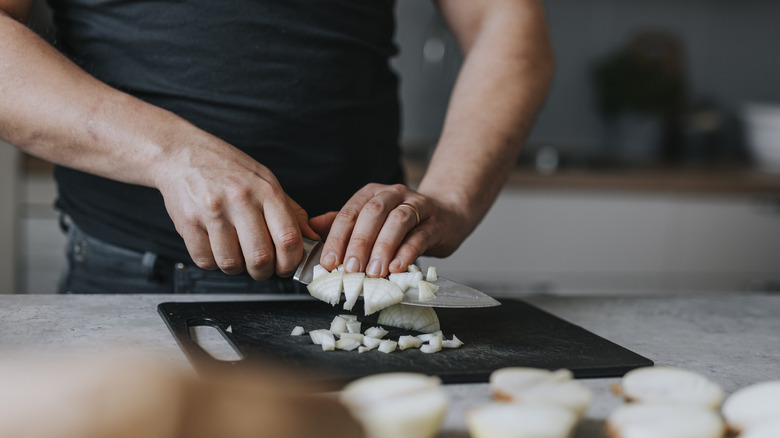 Man chopping onions