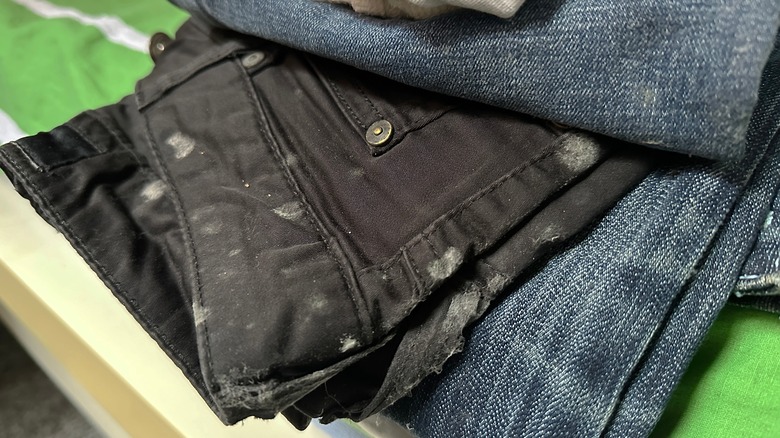 black jeans with gray mold spots