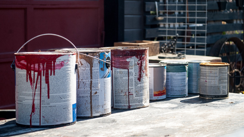 Paint cans on sidewalk