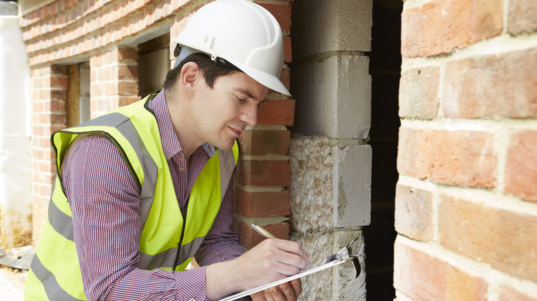 Man inspecting home