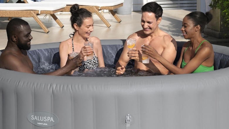 Four people in SaluSpa hot tub