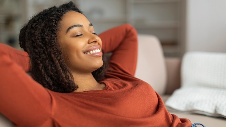 woman relaxing in recliner chair