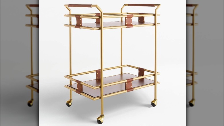 wooden bar cart with gold accents