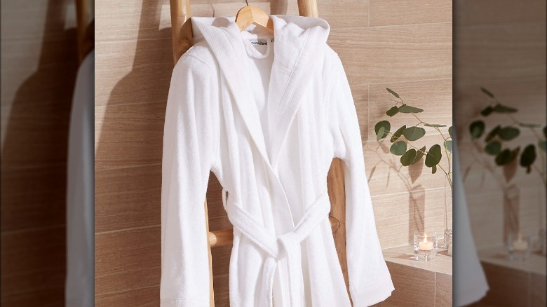 white bathrobe on wooden ladder