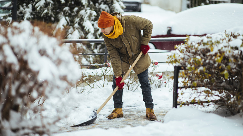 person shoveling snow