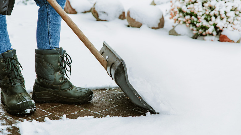 person shoveling snow