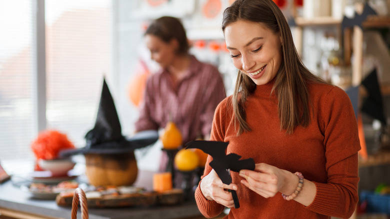 woman creating Halloween decorations