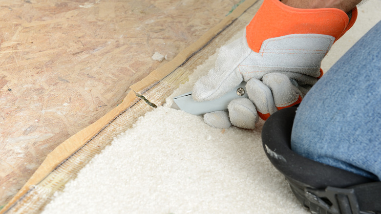 Person removing carpet