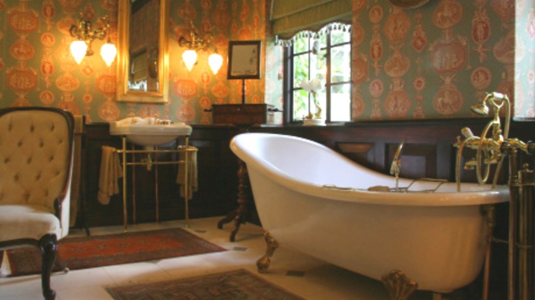 A bathroom with ornate brass fixtures