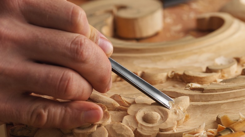 person using a wood chisel