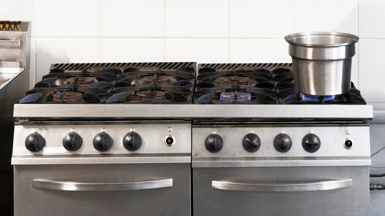 commercial-style stove with boiling pot