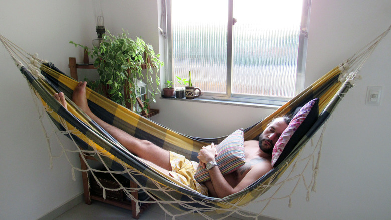 Person sleeping in Brazilian hammock