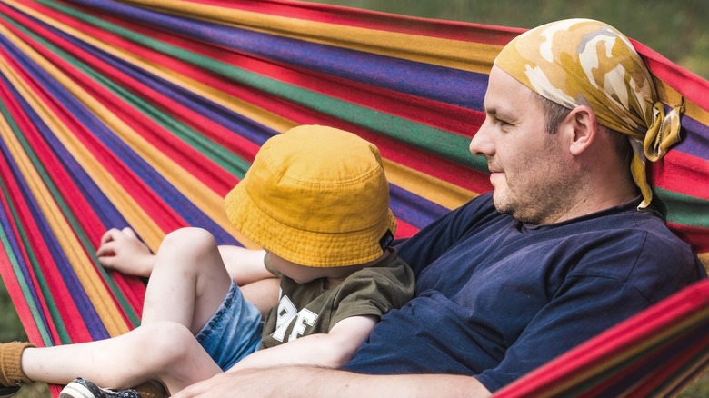 People enjoying colorful hammock