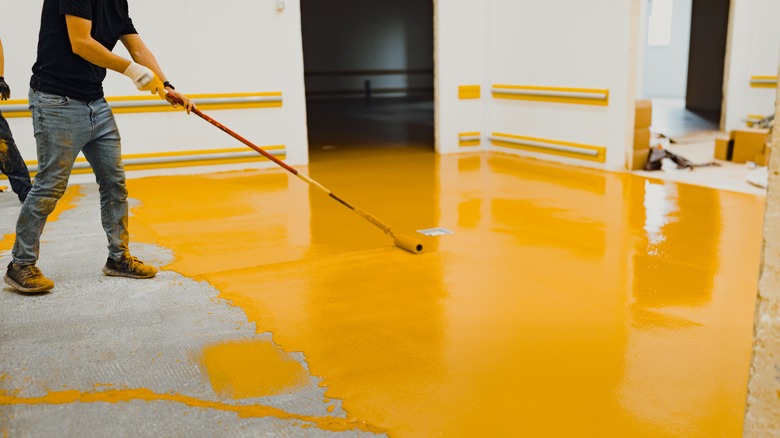 applying yellow polyurethane on garage floor