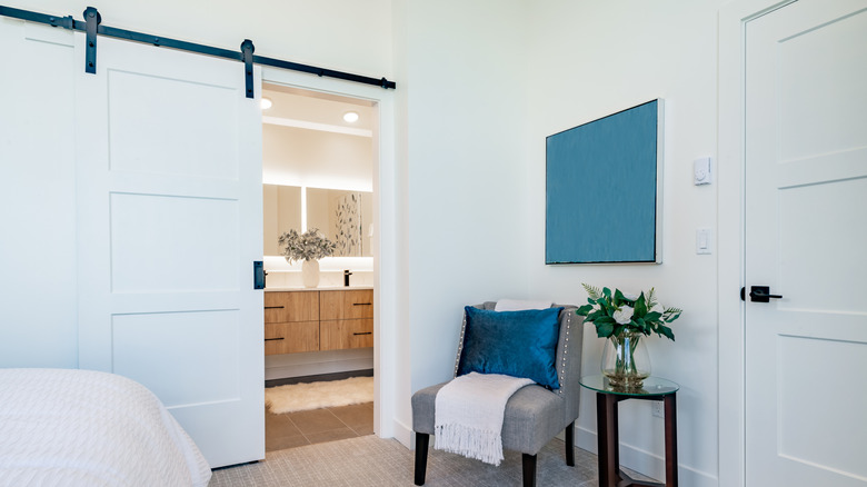 en-suite bathroom with white barn door