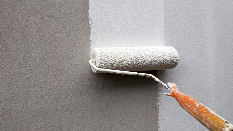 Paint roller on wall